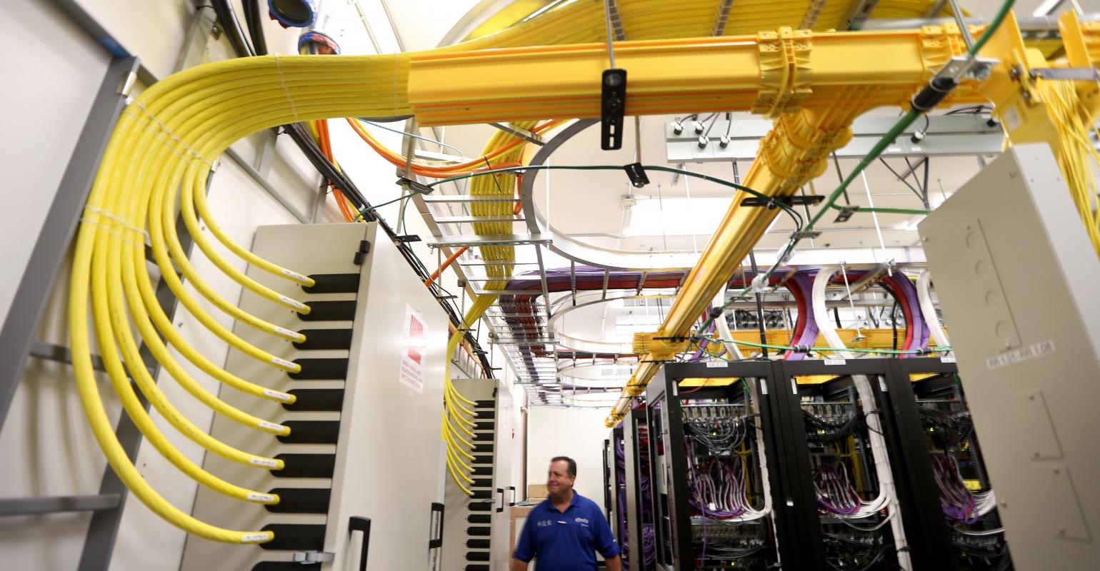 Network cables and routers in a telecom distribution center